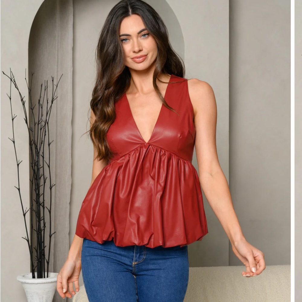 Size S. Faux Leather. Wine colored. From a boutique